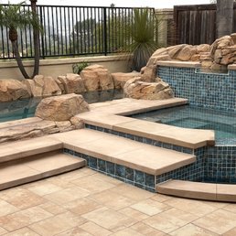 Spa tiles, new coping/steps, and pavers.