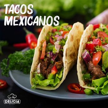 Delicia - two tacoss on a plate with lettuce and tomatoes - Honduran Near Me - Port Chester, New York Delicia - two tacoss on a plate with lettuce and tomatoes - Honduran Near Me - Port Chester, New York