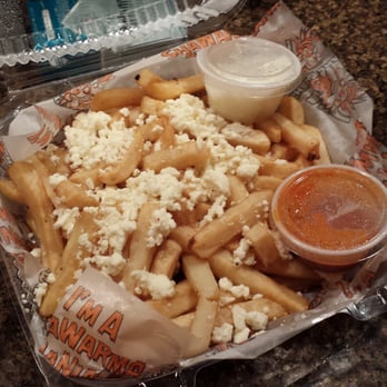 Shawarmaniac - Fries with a side of hot sauce and their amazing garlic sauce! - Lebanese Near Me - Kirkland, Washington Shawarmaniac - Fries with a side of hot sauce and their amazing garlic sauce! - Lebanese Near Me - Kirkland, Washington