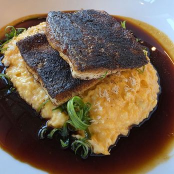 Roberto's Deluxe - Blackened trout, jalapeño pimento cheese grits, shaved scallion, demi-glaze - Desserts Near Me - Woodstock, Georgia Roberto's Deluxe - Blackened trout, jalapeño pimento cheese grits, shaved scallion, demi-glaze - Desserts Near Me - Woodstock, Georgia
