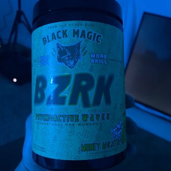 Nutrimart Poway - a hand holding a jar of black magic - Health Markets Near Me - Poway, California