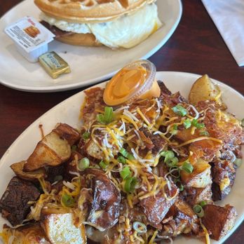 Blackbird - BLACKBIRD Loaded Homefries w/ Bacon & Cheese, Maple Sausage Waffle Sandwich - Cafes Near Me - Acton, Massachusetts
