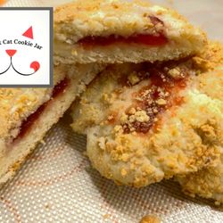 Strawberry Cheesecake Cookies! A big, soft style cookie that is thick and rich with real cream cheese, filled with strawberry and rolled in