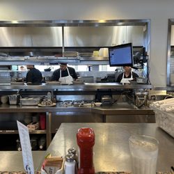 The Monument Café - Bar seating overlooks the kitchen