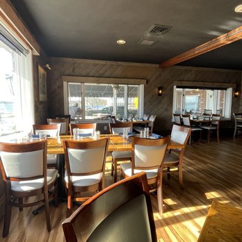 S S Dion - a dining room with wooden tables and chairs - Seafood Near Me - Bristol, Rhode Island