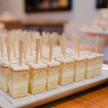 Baked - a plate of mini cakes with toothpicks on them - Custom Cakes Near Me - Seattle, Washington