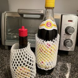 Hong Kong Supermarket - I asked for newspaper for my bottles of black vinegar & maggi. They had the Asian pear netting! Genious & green practice