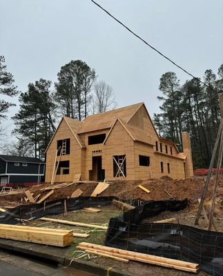 Beyond All Standards Construction Company Logo