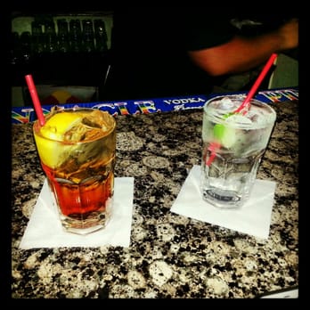 Woody's - two cocktails on a table - Gay Bars Near Me - Dallas, Texas Woody's - two cocktails on a table - Gay Bars Near Me - Dallas, Texas