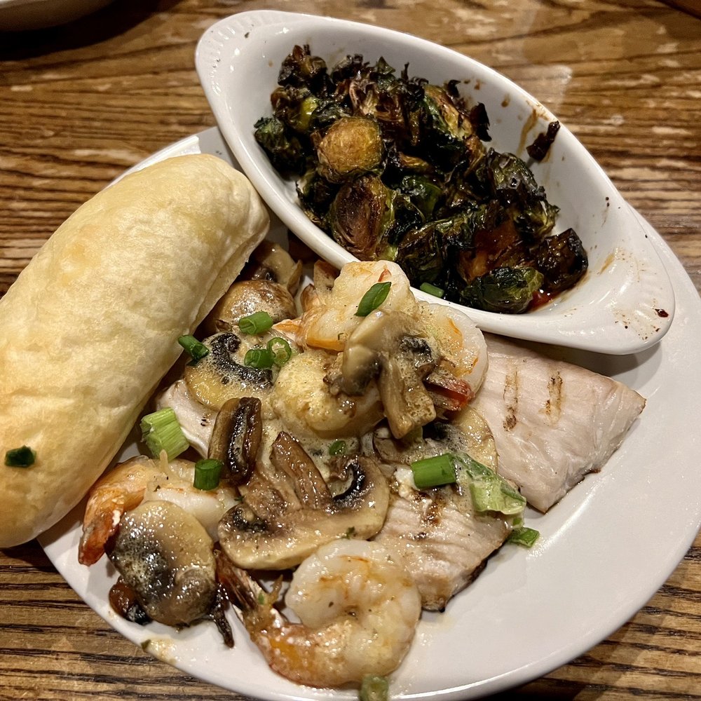 Parrain's Seafood - The Vermillion: Mahi Mahi covered in goodness, with a side of Honey Glazed Brussel Sprouts. - Southern Near Me - Baton Rouge, Louisiana