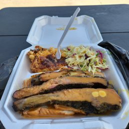 a plate of ribs and coleslaw