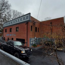 a truck parked in front of a building
