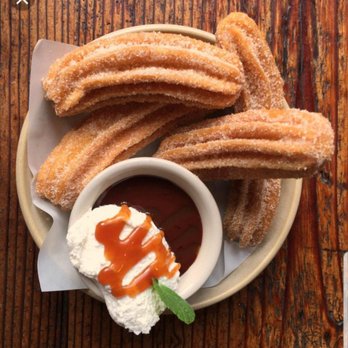 Nutty Bees - a plate of churros and a cup of ketchup - Specialty Food Near Me - Pueblo, Colorado