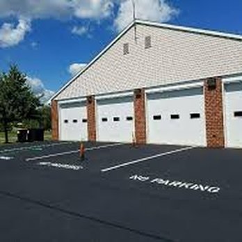 Sanatoga Sealcoating - a parking lot in front of a building - Landscaping Near Me - Douglassville, Pennsylvania Sanatoga Sealcoating - a parking lot in front of a building - Landscaping Near Me - Douglassville, Pennsylvania