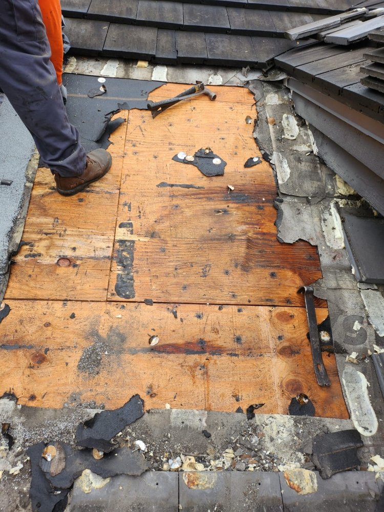 Slide of Extra Myles Roofing