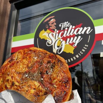 The Sicilian Guy - a hand holding a slice of pizza - Food Trucks Near Me - Jersey City, New Jersey The Sicilian Guy - a hand holding a slice of pizza - Food Trucks Near Me - Jersey City, New Jersey