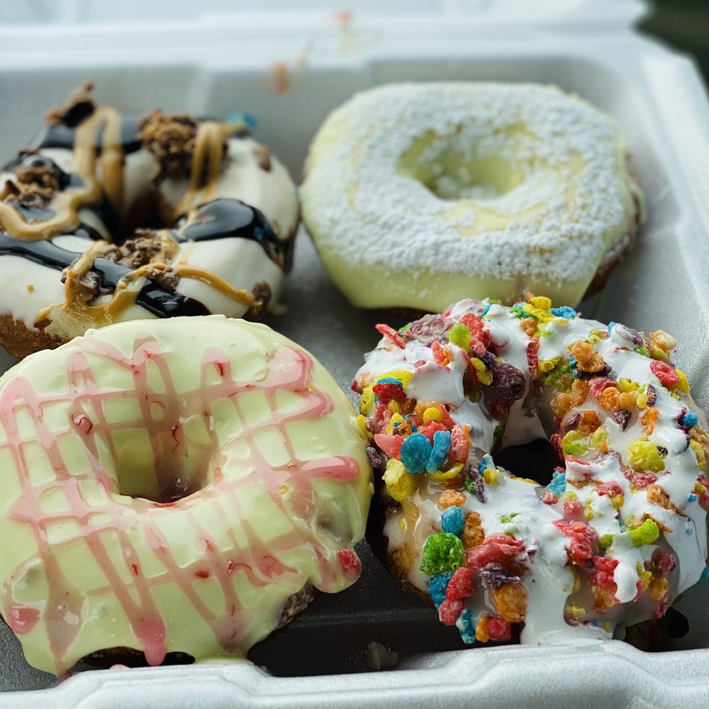 Mountain Donuts - The "Paulie," "Lemoncello," Fruity pebbles cereal with marshmallow creme, Lemon icing with raspberry drizzle - Donuts Near Me - South Ogden, Utah Mountain Donuts - The "Paulie," "Lemoncello," Fruity pebbles cereal with marshmallow creme, Lemon icing with raspberry drizzle - Donuts Near Me - South Ogden, Utah