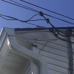 Lowe's Home Improvement - Gutter workmanship. Note the big gap at the top of my cornice that was never covered