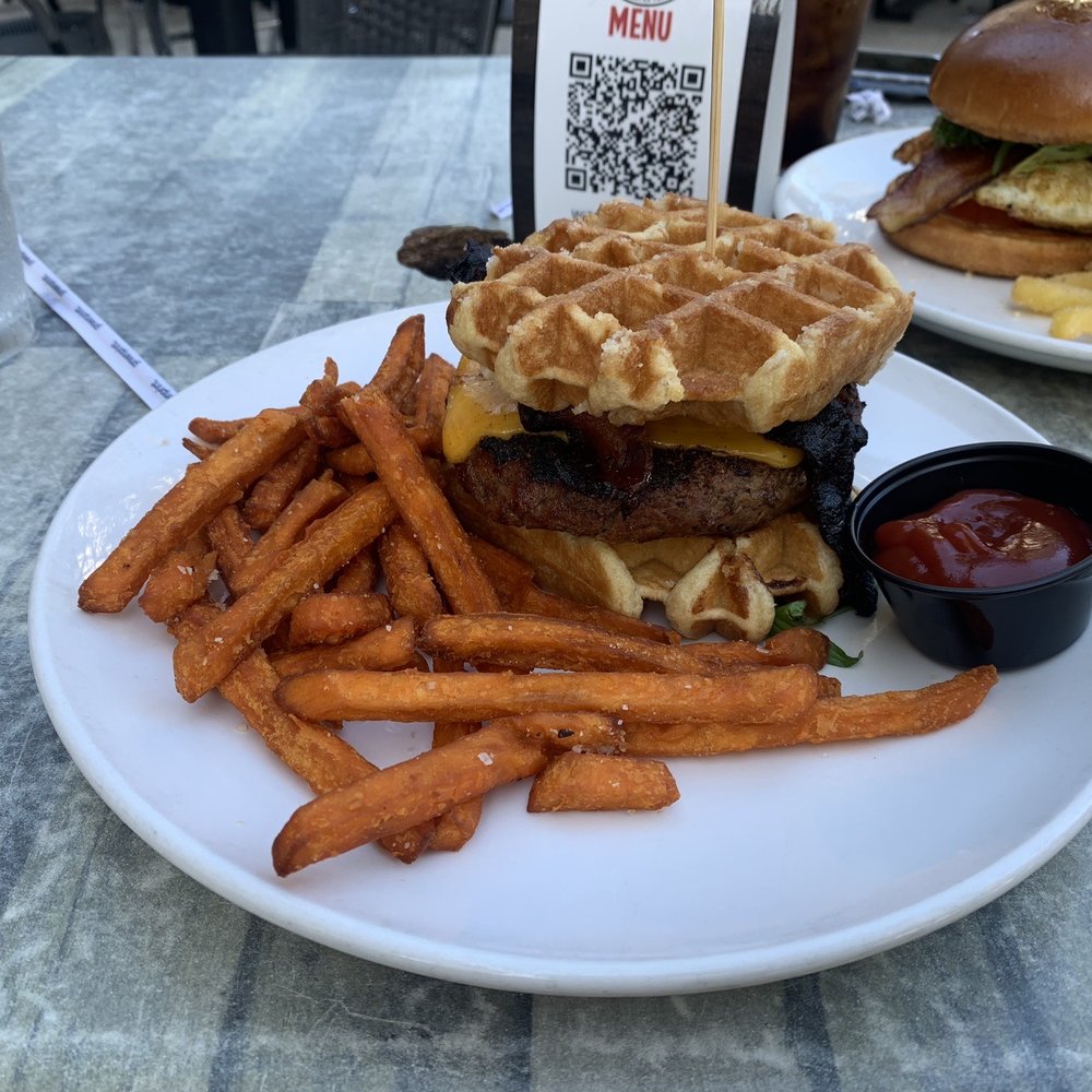 The Stubborn Mule - Belgian waffle burger with sweet potato fries and What came first chicken sandwich with rosemary Parmesan fries. - New American Near Me - Orlando, Florida The Stubborn Mule - Belgian waffle burger with sweet potato fries and What came first chicken sandwich with rosemary Parmesan fries. - New American Near Me - Orlando, Florida