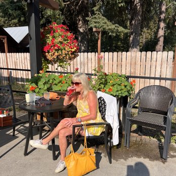 Chimney Rock Cafe - Enjoying my huckleberry mimosa on the flowery, charming patio! - Breakfast & Brunch Near Me - Priest River, Idaho