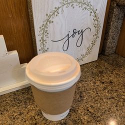 Downtown Coffee - My hot gingerbread ka'u latte with an extra shot. YUM. Next to a cute holiday decoration