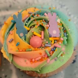 Coconut Cream cupcakes with rainbow cream cheese buttercream