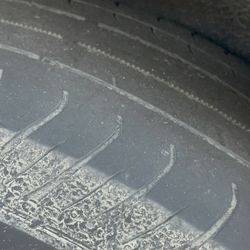 Budget Car & Truck Rental - Scary bald tire with cable visible