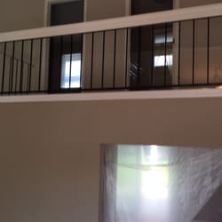 Baby Home Safety - Unsafe distance between wrought iron balcony slats was solved with plexiglas