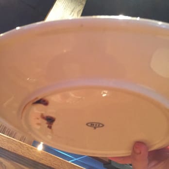 Outback Steakhouse - This was the underside of the plate which was only cleaned on one side and I saw this when the manager/server brought it to us - Steakhouses Near Me - Lithia, Florida