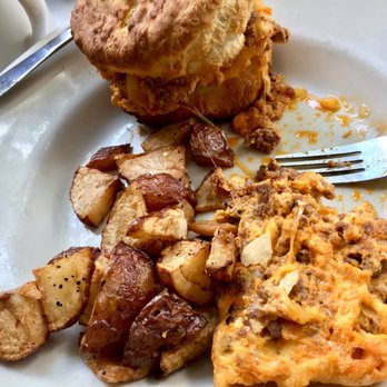Sunset Grill - Hubs' chorizo omelette w/ house made biscuit and potatoes - He put part of his omelette on the biscuit lol - American Near Me - Fredericksburg, Texas