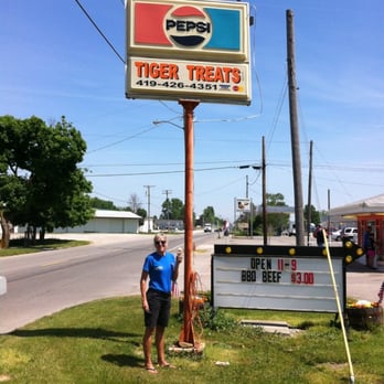 Tiger Treats - a man standing in front of a sign - Ice Cream & Frozen Yogurt Near Me - Attica, Ohio Tiger Treats - a man standing in front of a sign - Ice Cream & Frozen Yogurt Near Me - Attica, Ohio
