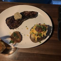 Kansas City strip and fully loaded baked potato