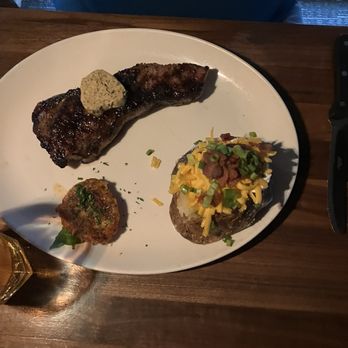 Bartlett's - Kansas City strip and fully loaded baked potato - Steakhouses Near Me - Austin, Texas