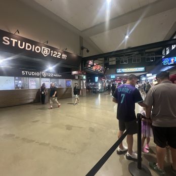 Chase Field - Inside a large indoor sports or entertainment venue, people are waiting in line near ticket or entrance counters, with signage and screens visible. - Stadiums & Arenas Near Me - Phoenix, Arizona
