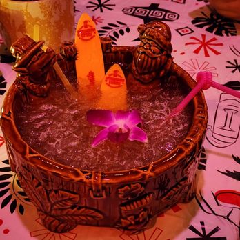 PufferFish - a drink in a wooden bowl with a purple flower - Cocktail Bars Near Me - Milwaukee, Wisconsin