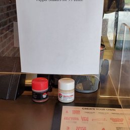 a sign on the counter of a restaurant a sign on the counter of a restaurant