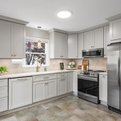 Kitchen Doctors - Showplace Cabinets offer multiple customization options and color choices. Light Mocha cabinets, Taj Mahal quartzite tops.