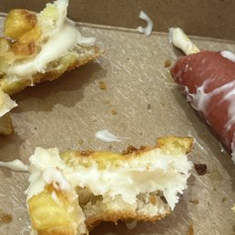Raw batter not cheese on original potato corn dog. Raw batter not cheese on original potato corn dog.