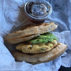Conscious Plates - Breakfast Sandwich TOGO = Wheat-Free Spelt Waffles + Chickpea Eggs scrambled with Zuchinni & Onion + Avocado Slices #YUMMIE