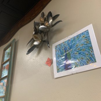 Charlie's Restaurant & Catering - Some of the art for sale on the walls. - Seafood Near Me - Violet, Louisiana