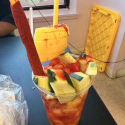 Tornado cup ,mango ,cucumbers ,watermelon, jicama and peanuts in mango juice