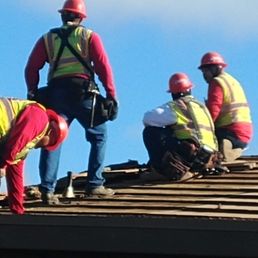 Roofers carefully deciding on a solution to a problem! Roofers carefully deciding on a solution to a problem!