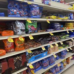 a grocery store aisle filled with snacks a grocery store aisle filled with snacks