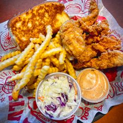 Raising Cane's Chicken Fingers - Chicken and chips