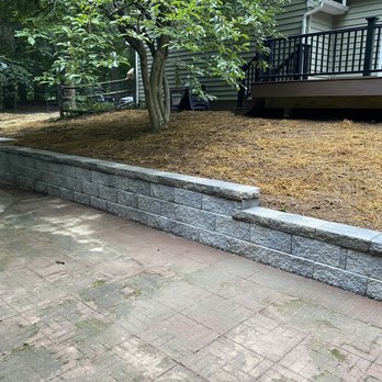 Burns Masonry & Construction - The new EP Henry paver wall Matt and his team built looks stunning and is supported with proper drainage. - General Contractors Near Me - Collegeville, Pennsylvania