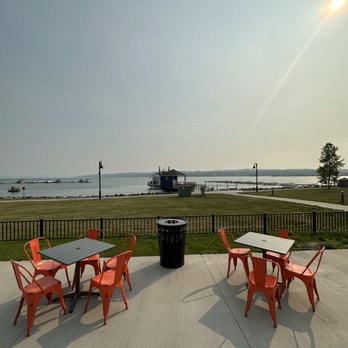 The Birdcage - a table and chairs on the patio - Cocktail Bars Near Me - Canandaigua, New York
