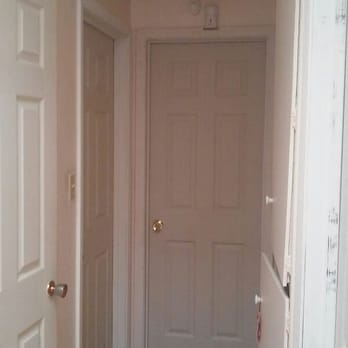 Rowmack - Hallway with 6 doors, Removed and replaced with upgraded trim. - Handyman Near Me