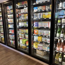Tilted Bottles Wine, Beer & More - Hard seltzers.