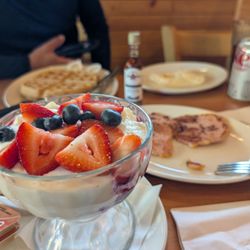 Sunset Grill - Yogurt with fruit (hard to see the granola but it's on the side), other food in the back
