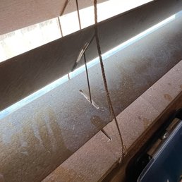 Dusty blinds at table